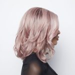 Stylish pink wavy wig from Hidden Secrets Wigs for fashion and elegance.