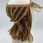 Wavy bob wig with halo cap on mannequin head for natural look.