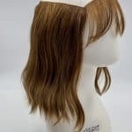 Wavy bob wig with halo cap on mannequin head for natural look.