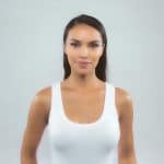 Woman with natural hair wearing a wig from Hidden Secrets Wigs.