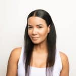 Elegant woman wearing Malibu TP Noriko Collection wig for a natural look.