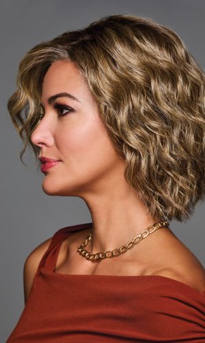 Wavy blonde bob wig styled on a woman with side profile view.