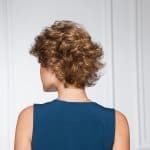 Short curly wig for women with light brown hair, styled in a voluminous, natural look.