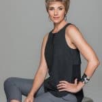 Woman with short, layered wig in a modern, stylish look.