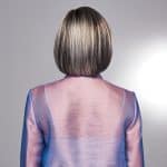 Back view of a sleek, straight bob wig in ash blonde with dark roots.