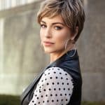 Stylish short blonde pixie wig on a woman with a modern haircut.