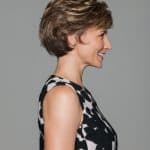Short wavy wig for women with layered style and natural brown color.