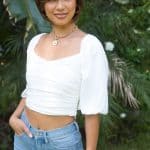 Woman wearing a short brown bob wig from Hidden Secrets Wigs.