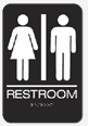 Accessible restroom sign with wheelchair symbol and female/male icons.