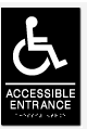 Accessible entrance sign with wheelchair symbol for disability access.