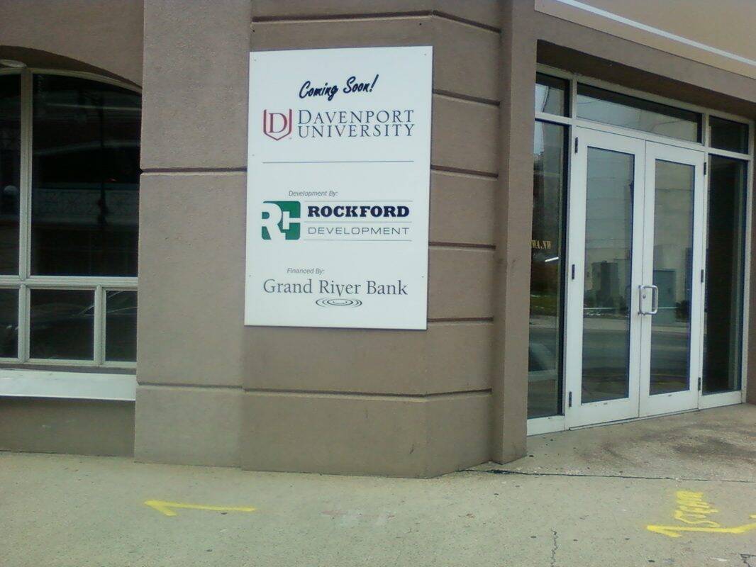 Sign for Davenport University and Rockford Development outside building.