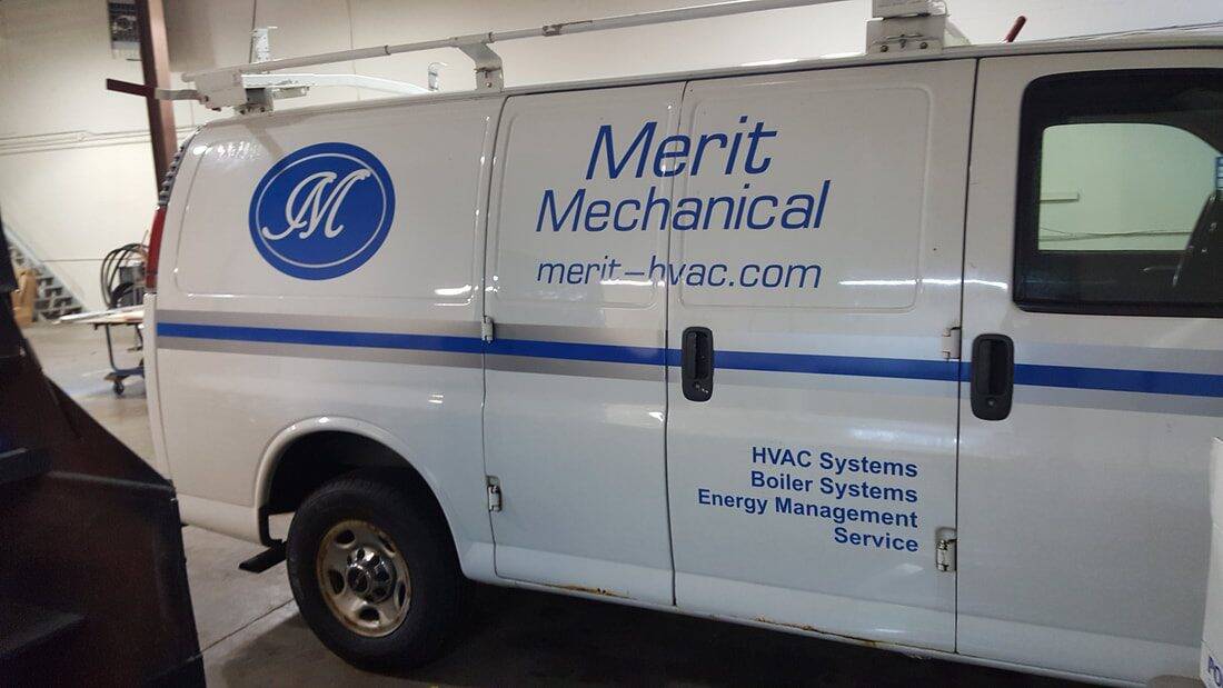 Service van with handicap accessibility sign and company branding.