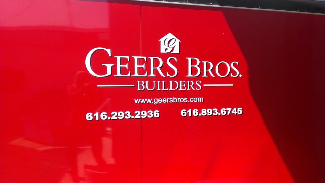Geers Bros Builders logo with contact info on red background.