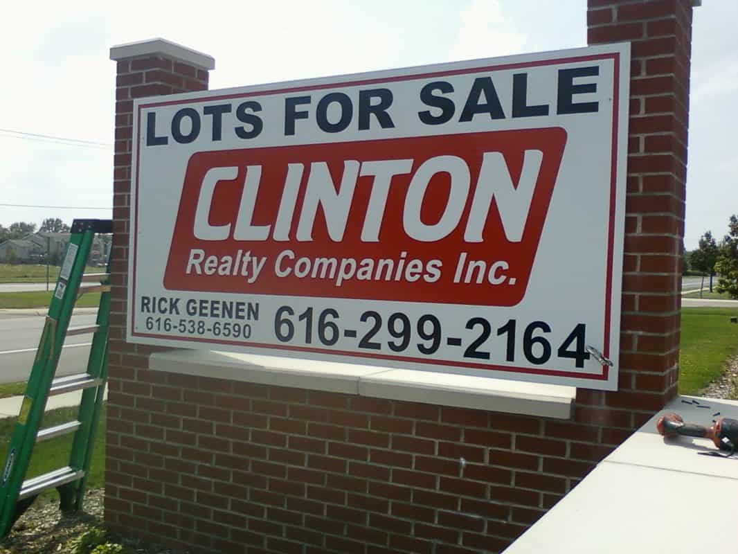 Real estate sign advertising lots for sale by Clinton Realty Inc.