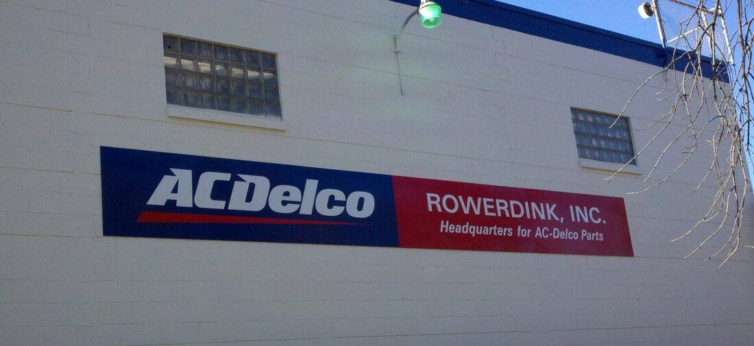Signage for ACDelco and Rowerdink Inc. on building exterior.