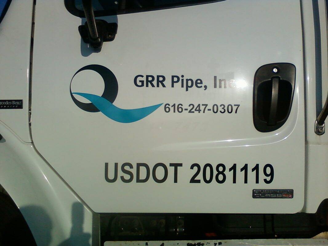 Vehicle with Handicap Sign Inc. logo and contact details.