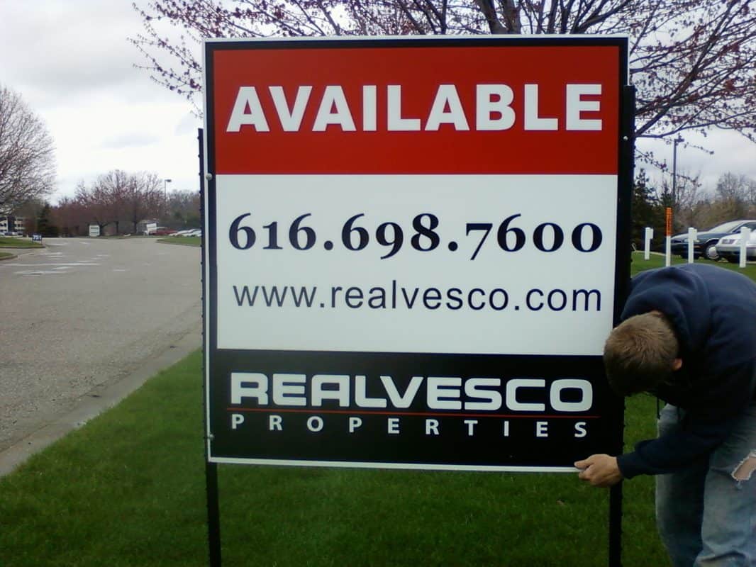 Handicap sign with contact info and property availability details.