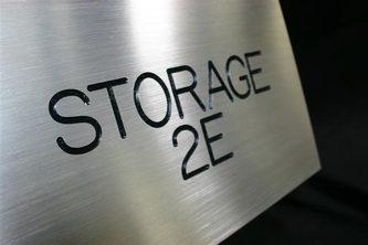 Storage 2E sign on metallic surface at Handicap Sign Inc.