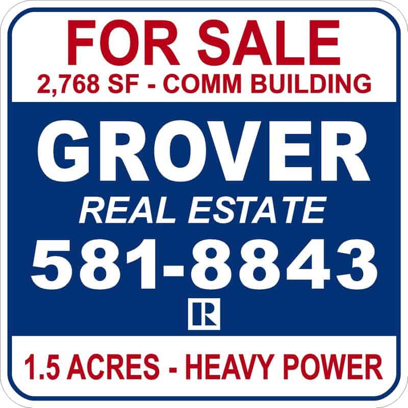 Real estate for sale sign with contact number and property details.