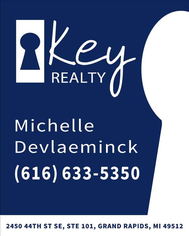 Business card for Key Realty with contact info and logo.