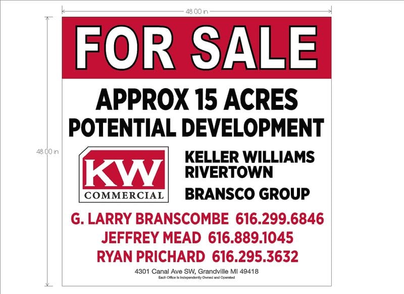 For sale sign advertising 15 acres of potential development land in Rivertown.
