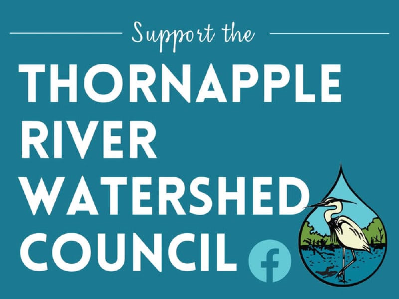 Handicap accessible parking sign with Watershed Council logo and water droplet icon.