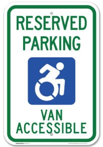 Reserved parking sign for van accessible with wheelchair symbol.