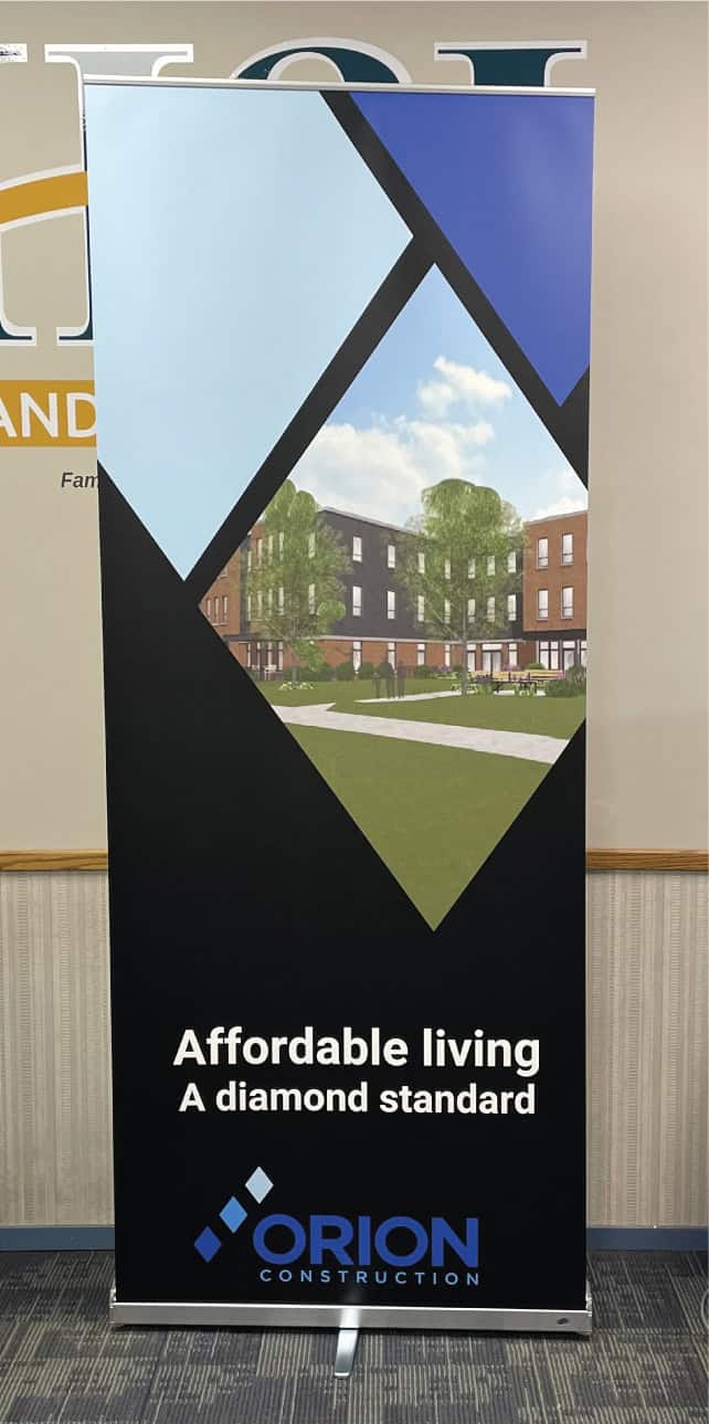 Banner displaying accessible living with a modern building and blue sky.