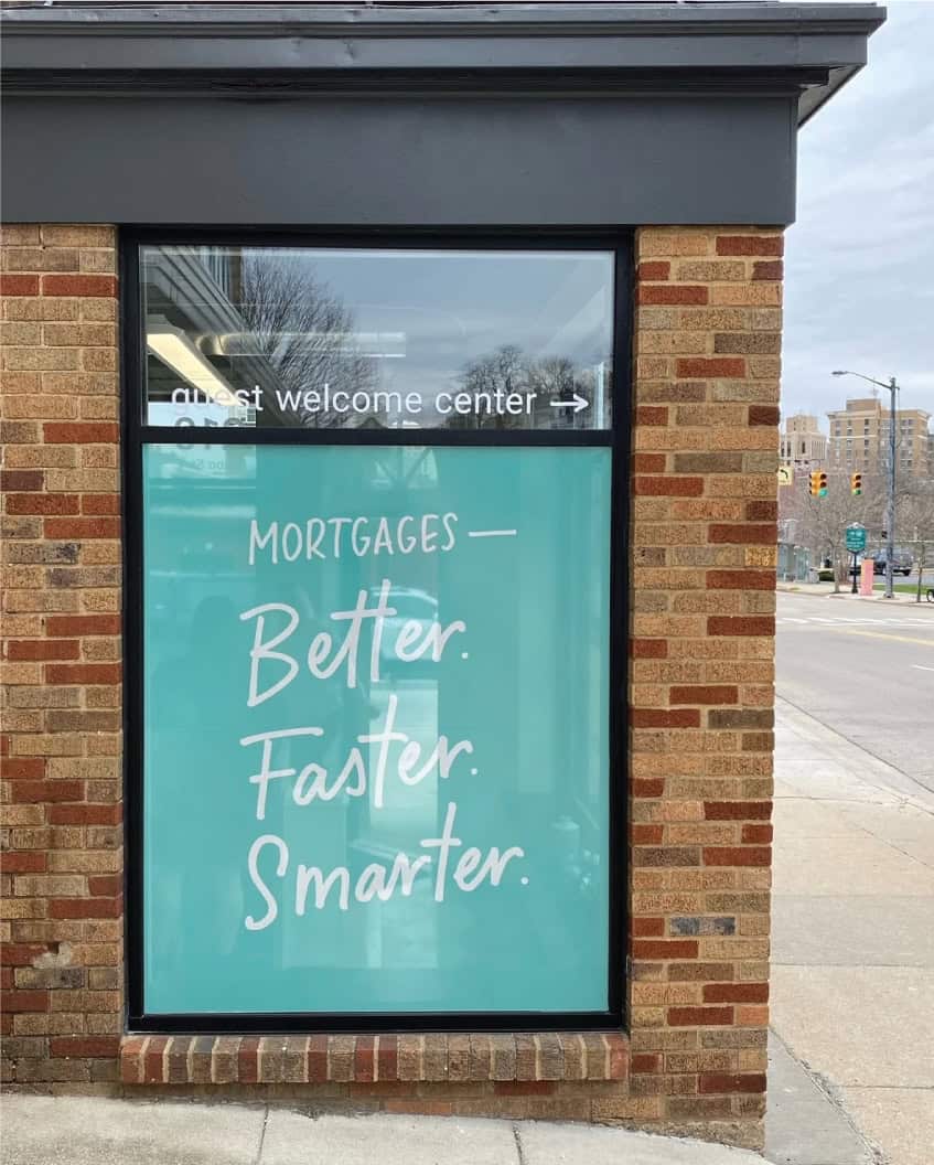 Window sign for mortgage services with slogan Better, Faster, Smarter.