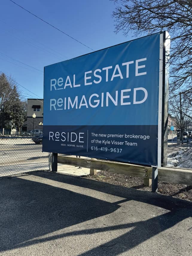 Large blue billboard for real estate reimagined with contact info and branding.