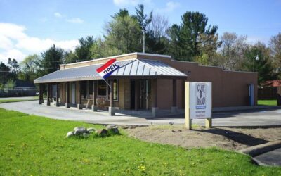 Ice Box Brand store with open sign and outdoor seating area.