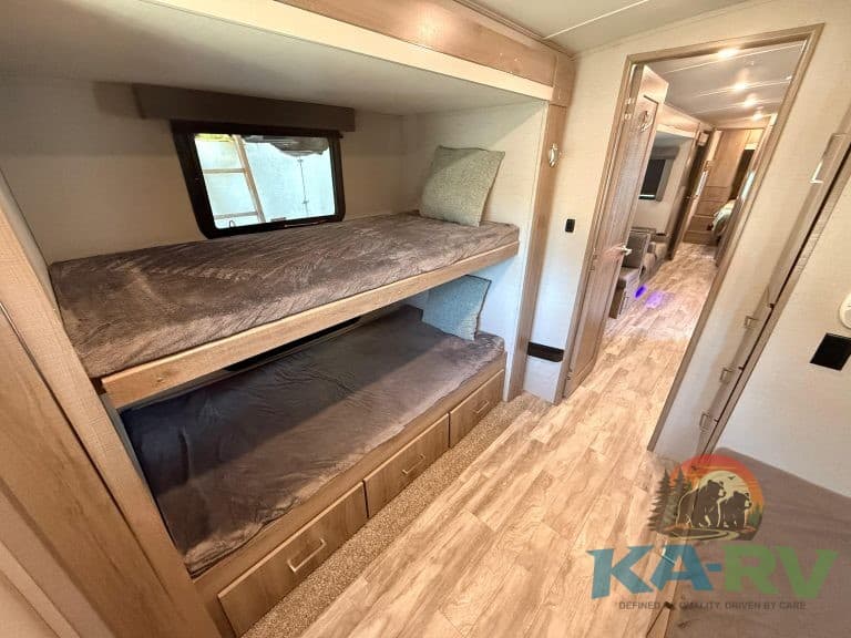 RV bunk beds with storage drawers, ideal for space-saving and comfort. Perfect for Optima RVs and si.