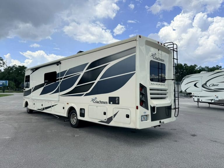 2023 Coachmen Mirada 35OS motorhome parked outdoors with blue sky.