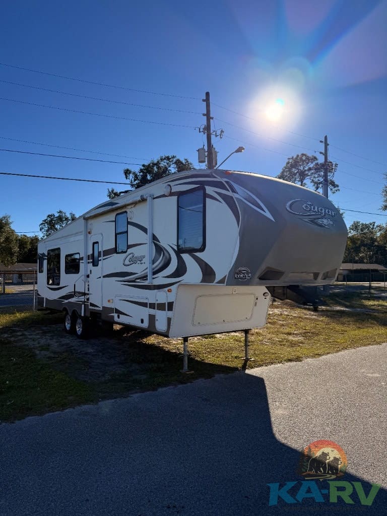 Luxury Keystone Cougar 331MKS travel trailer with modern amenities.