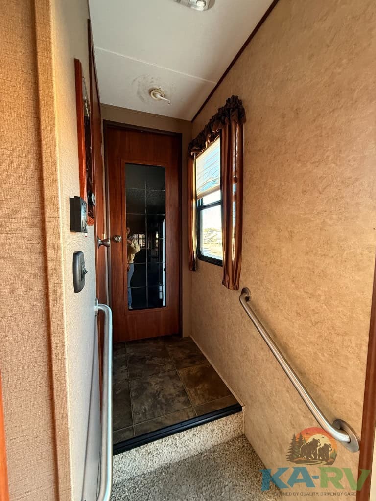 Interior shot of a 2014 Keystone Cougar RV hallway.