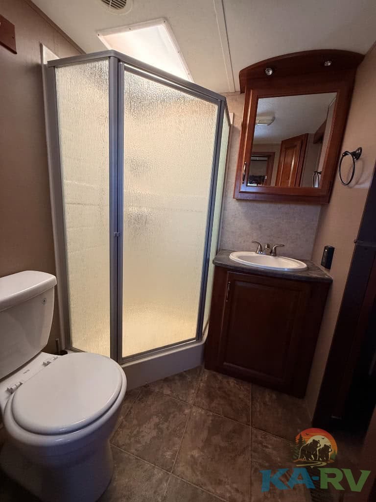 Bathroom shower and vanity in a 2014 Keystone Cougar 331MKS.