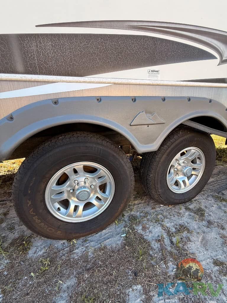 RV trailer wheel and tire setup for Keystone Cougar 2014 model.