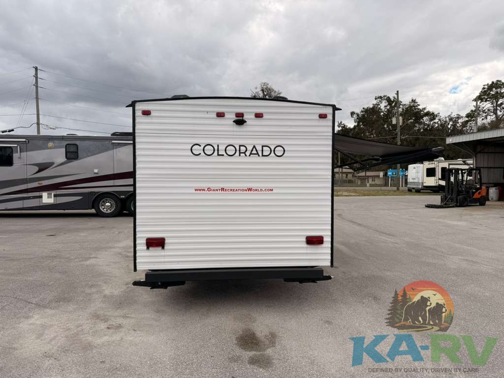Rear view of Keystone Colorado 17RBC travel trailer in outdoor lot.