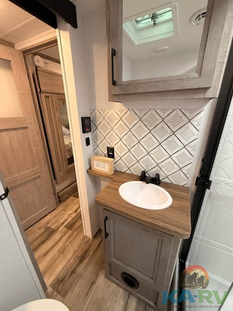 Accessible RV bathroom with modern fixtures.