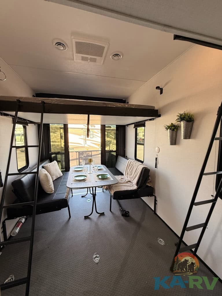 Versatile RV interior with seating and dining area for optimal travel comfort.