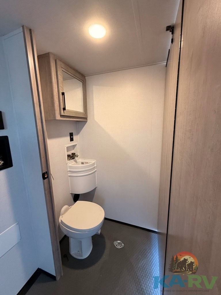 RV bathroom interior with compact design and modern fixtures.