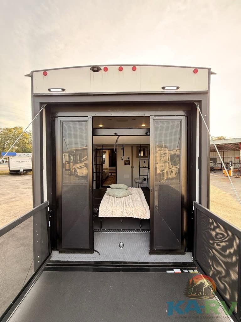RV bedroom interior with modern design, cozy bedding, and accessible entry for optimal comfort and c.