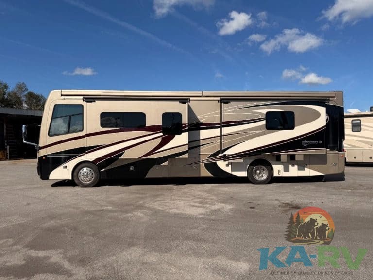 An image of a 2018 Fleetwood Discovery 39F RV parked outdoors.