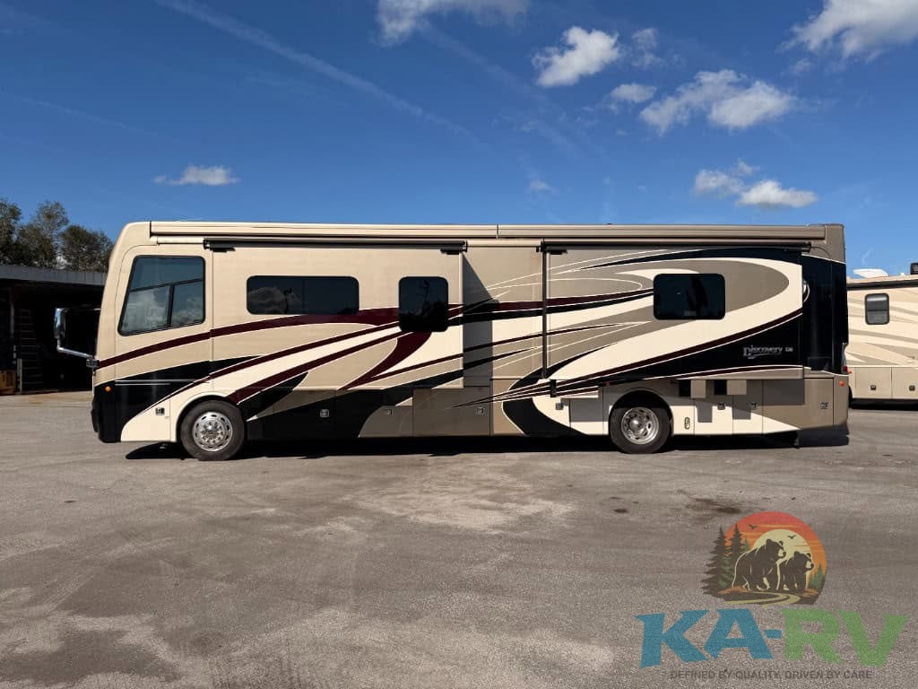 An image of a 2018 Fleetwood Discovery 39F RV parked outdoors.