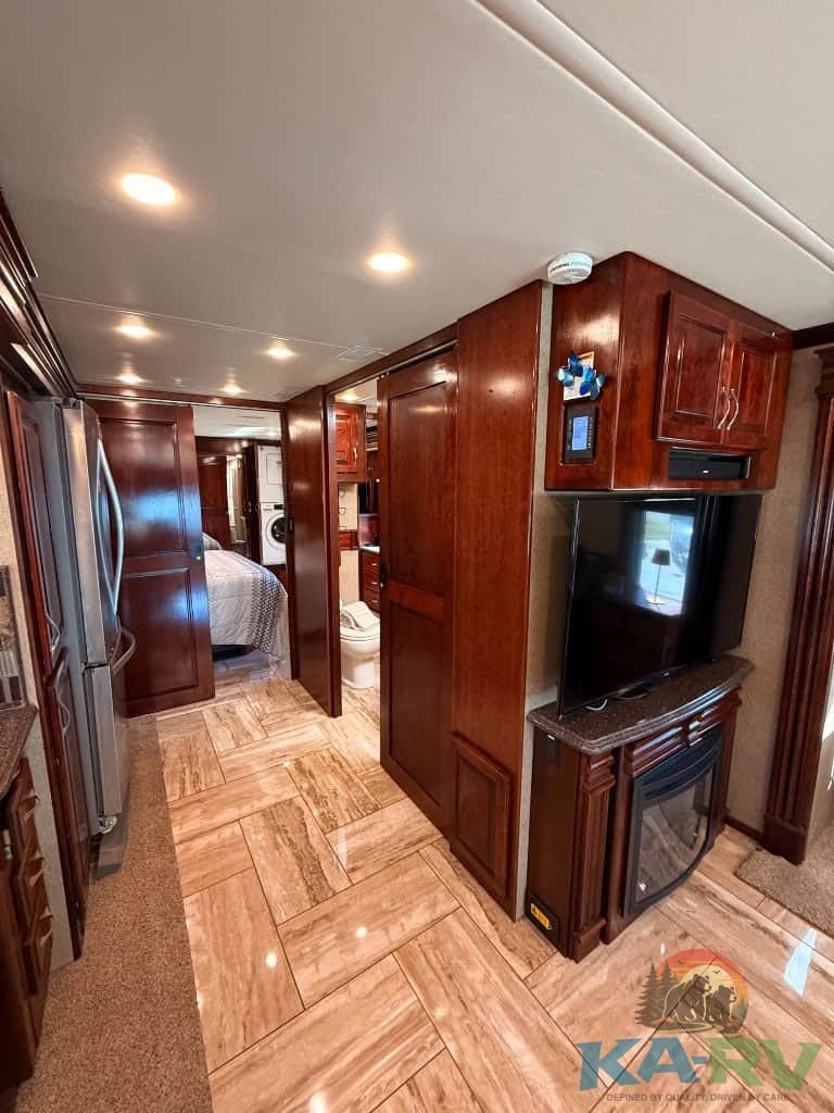 Comfortable RV living space with wood cabinetry and modern amenities.