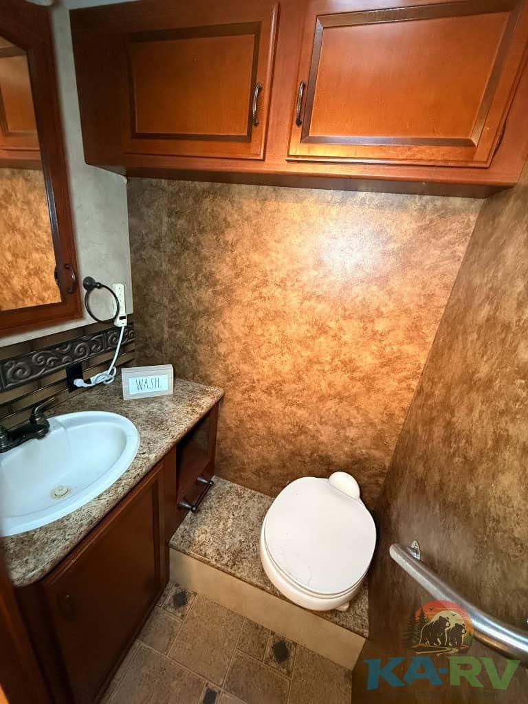 Bathroom interior of a 2013 Four Winds Hurricane RV.