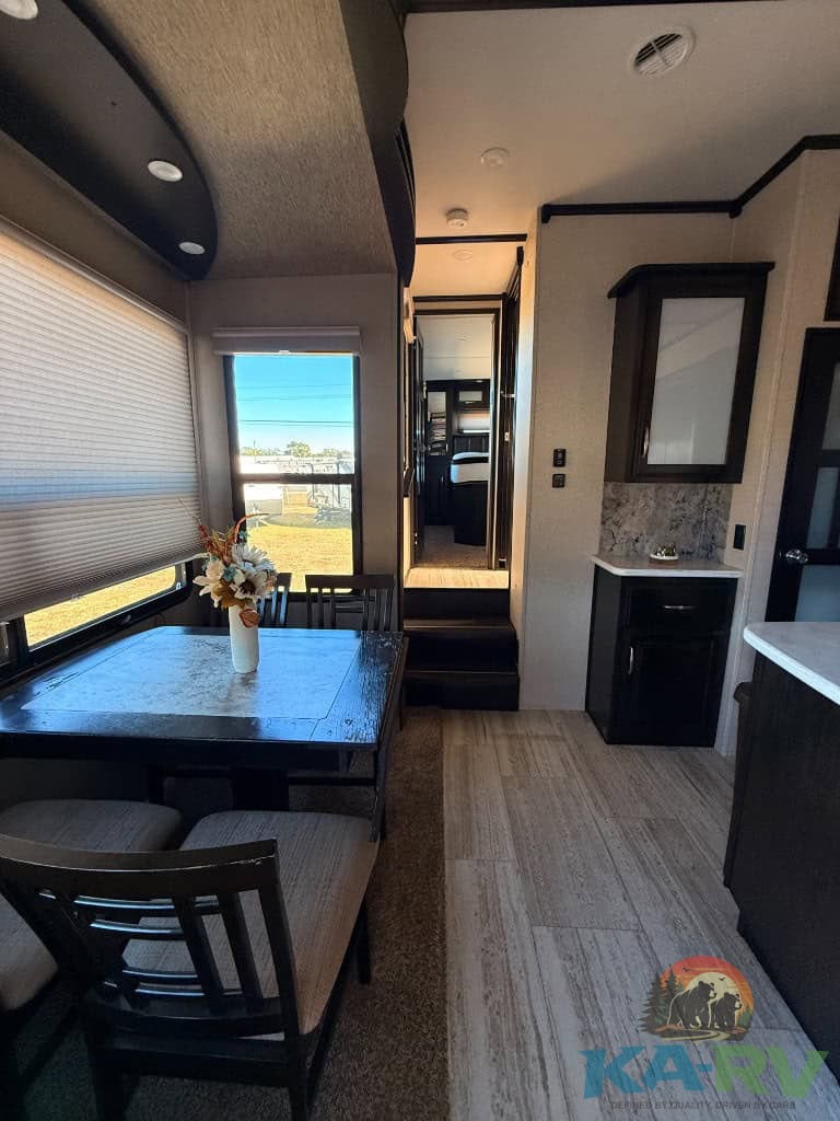 Interior of a 2017 Grand Design Momentum 376TH RV, showcasing the living and kitchen space.