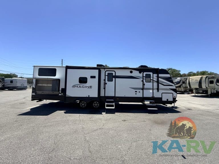 Modern travel trailer parked at KA RV Repair for maintenance and repairs.