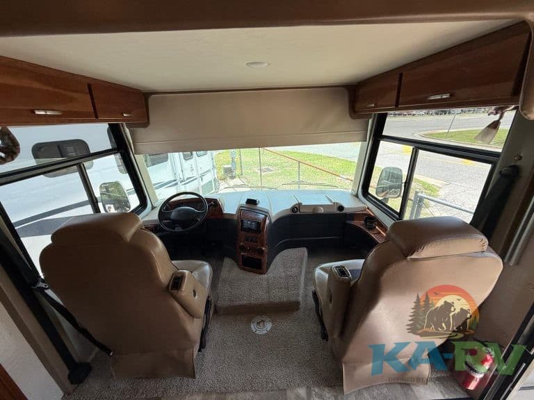 Luxury RV dashboard with driver and passenger seats, showcasing interior repair and maintenance serv.