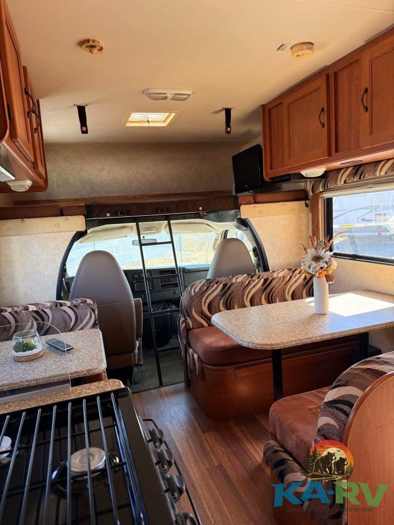 Accessible RV interior with cozy seating and dining area.
